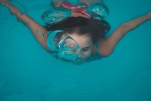 Girl swimming under water