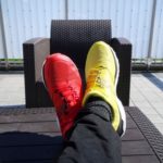 a red shoe and a yellow shoe